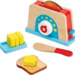 A wooden toaster with pretend bread and butter